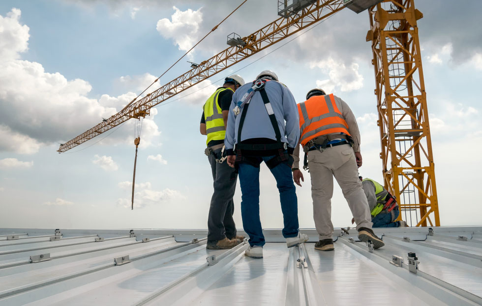 Construction workers on a roof